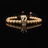 Pulseira de aço titânio com pérola de abacaxi coroa dourada e diamante